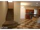 View of kitchen and staircase with checkered floor at 1837 Ardilea St, Las Vegas, NV 89135