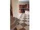 Kitchen with wooden cabinets and checkered floor at 1837 Ardilea St, Las Vegas, NV 89135