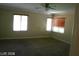 Bedroom with carpeted floors and large windows at 1837 Ardilea St, Las Vegas, NV 89135