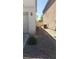 Side yard with gravel and AC units at 5213 Castle Butte Ct, North Las Vegas, NV 89031