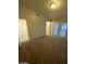 Spacious bedroom with door to bathroom and patio access at 1617 Joshua Tree Ct, Las Vegas, NV 89108