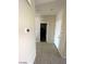 Hallway with tile floors and access to bedrooms at 2409 W Gilmore Ave, North Las Vegas, NV 89032