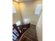 Indoor staircase with wooden railings and carpeted steps at 2409 W Gilmore Ave, North Las Vegas, NV 89032