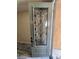 Gray front door with an ornate glass insert at 9758 Panther Hollow St, Las Vegas, NV 89141