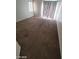 Spacious carpeted bedroom with sliding glass door at 5316 Clover Blossom Ct, North Las Vegas, NV 89031