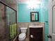 Bathroom with teal walls, a shower, and vanity at 780 S Lawson Dr, Moapa, NV 89025