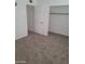 Simple bedroom with carpet flooring and closet at 1932 Lawry Ave, North Las Vegas, NV 89032