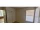 Bright bedroom with double door closet and window coverings at 4774 Willow Glen Dr, Las Vegas, NV 89147