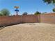 Spacious backyard with gravel and a fire pit area at 3012 Silver Canyon Ln, North Las Vegas, NV 89031