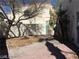 Backyard with a tree, gate, and patio at 8829 Cornwall Glen Ave, Las Vegas, NV 89129