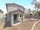 House exterior showcasing a covered patio and desert landscaping at 9509 Swiss Stone Ct, Las Vegas, NV 89123