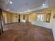 Open living room with tile floors and chandelier at 4565 Riva De Romanza St, Las Vegas, NV 89135