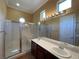 Bathroom with double sinks, a large shower, and updated fixtures at 4565 Riva De Romanza St, Las Vegas, NV 89135