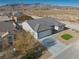 Aerial view of a single-story house with a small front yard at 5130 Valero Ct, Pahrump, NV 89060