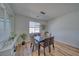 Dining room with glass table and hardwood floor at 6440 Montclair St, Pahrump, NV 89061