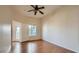 Bright bedroom with wood flooring, ceiling fan, and access to balcony at 9303 Gilcrease Ave # 2219, Las Vegas, NV 89149