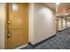 Building hallway with carpeted floors and neutral walls at 55 E Agate Ave # 202, Las Vegas, NV 89123