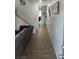 Long hallway with tile floors leading to other rooms at 9794 Villa Lorena Ave, Las Vegas, NV 89147