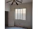 Simple bedroom with ceiling fan and window at 529 Rancho Del Mar Way, North Las Vegas, NV 89031