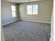 Bright bedroom with grey carpet and window at 7132 Port Stephens St, North Las Vegas, NV 89084