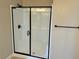 Large walk-in shower with frameless glass enclosure at 7148 Port Stephens St, North Las Vegas, NV 89084