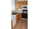 Kitchen with double sink, dishwasher and wood cabinets at 1236 Dusty Creek St, Las Vegas, NV 89128