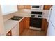 Kitchen with wood cabinets, gas stove and refrigerator at 1236 Dusty Creek St, Las Vegas, NV 89128