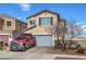 Two-story house with a red truck in the driveway at 1168 Aspen Cliff Dr, Henderson, NV 89011