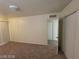 Bedroom with carpeted floor, double closet and access to another room at 4808 Everman Dr, Las Vegas, NV 89122