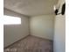 Simple bedroom with carpeted floor and window at 4808 Everman Dr, Las Vegas, NV 89122