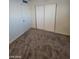 Simple bedroom with carpet and sliding door closet at 4808 Everman Dr, Las Vegas, NV 89122