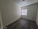 Bright bedroom with dark grey wood-look floors and large closet at 1317 Exley Ave, Las Vegas, NV 89104