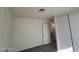 Bedroom with grey floor, closet and door at 1317 Exley Ave, Las Vegas, NV 89104