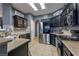 Modern kitchen with stainless steel appliances and dark cabinetry at 1240 Country Club, Laughlin, NV 89029