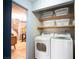 Laundry room with washer, dryer, and shelving at 2841 Glendevon Cir, Henderson, NV 89014