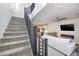 Modern staircase with dark metal railing and carpeted steps at 52 Kimberlite Dr, Henderson, NV 89011