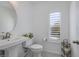 Clean and bright bathroom with pedestal sink and modern fixtures at 52 Kimberlite Dr, Henderson, NV 89011