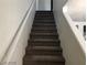 Carpeted staircase leading to the upper level at 11882 Snow Bank St, Las Vegas, NV 89183