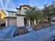 Two story house with attached garage and landscaped yard at 11882 Snow Bank St, Las Vegas, NV 89183