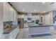 Modern kitchen with stainless steel appliances and ample counter space at 593 Desert Bluebell Ct, Henderson, NV 89011