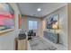 Home office features wood desk, grey dresser, and artwork at 593 Desert Bluebell Ct, Henderson, NV 89011