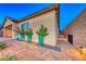 Landscaped side yard with walkway and lighting at 593 Desert Bluebell Ct, Henderson, NV 89011