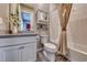 Clean bathroom with white cabinets and subway tile at 593 Desert Bluebell Ct, Henderson, NV 89011