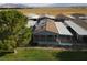 Aerial view of a home with solar panels and a covered patio, near a grassy area at 880 Montecito Dr, Pahrump, NV 89048