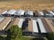 Aerial view of multiple homes with solar panels, showcasing a consistent design at 880 Montecito Dr, Pahrump, NV 89048