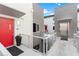 Modern building with red door and elevator access at 11441 Allerton Park Dr # 411, Las Vegas, NV 89135