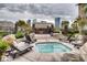 Community hot tub with lounge chairs and city views at 4200 S Valley View Blvd # 3051, Las Vegas, NV 89103