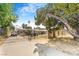 Home's gated entry with a long driveway leading to the house at 3104 Dillon Ave, North Las Vegas, NV 89030