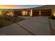 Modern home exterior with concrete driveway and desert landscaping at 10 Chisel Crest Ct, Henderson, NV 89012