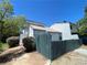 View of the home's exterior and dark green fence at 4281 White Sands Ave, Las Vegas, NV 89121